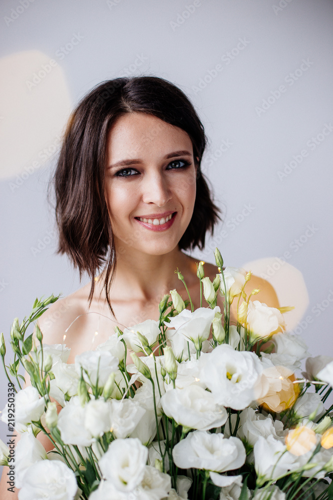 Beautiful girl with a bouquet flowers. Beautiful girl with a bouquet flowers.