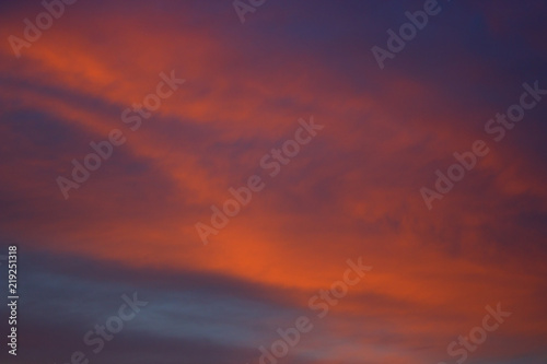 View on beautiful pink clouds in a pink blue sky. © beldesigne