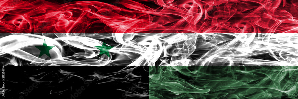 Syria vs Hungary smoke flags placed side by side. Thick colored silky smoke flags of Syrian and Hungary