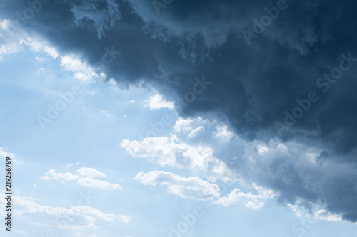 Stormy cumulus clouds of gray and blue background before a thunderstorm