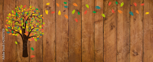 Autumn Leaves and tree on old wooden background