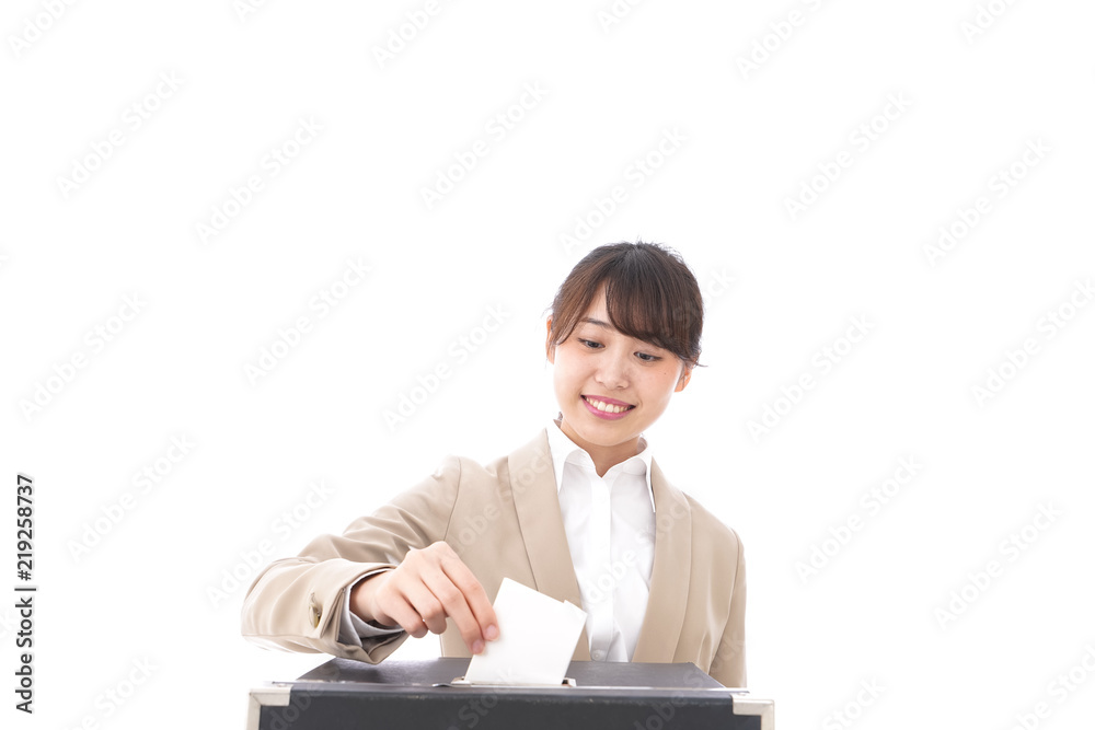 選挙の投票をする有権者 選挙の投票をする有権者