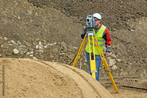 Topographical survey of the terrain by a surveyor