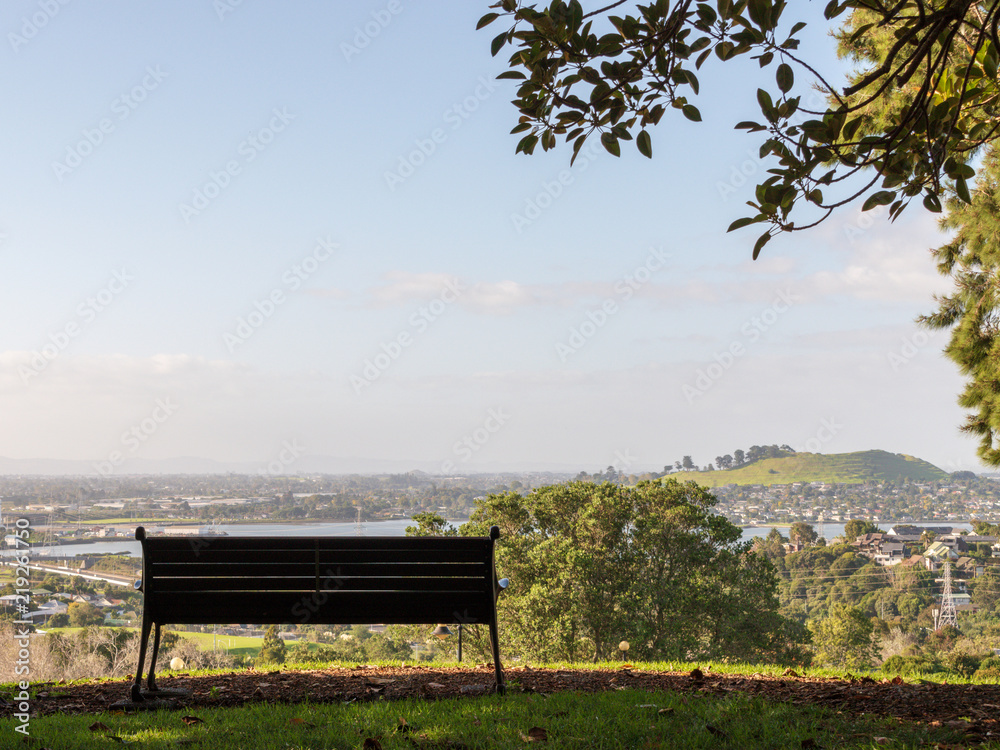 Empty park bench on a hill Empty park bench on a hill
