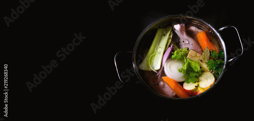 Chicken broth with vegetables photo