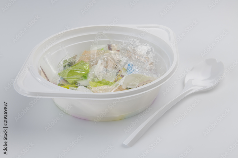 Plastic soup bowl and spoon with plastic soup. Plastic soup bowl and spoon with plastic soup.