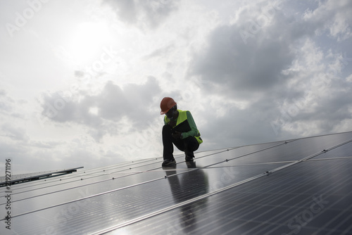 Technician engineer checks the maintenance of the solar cell panels.