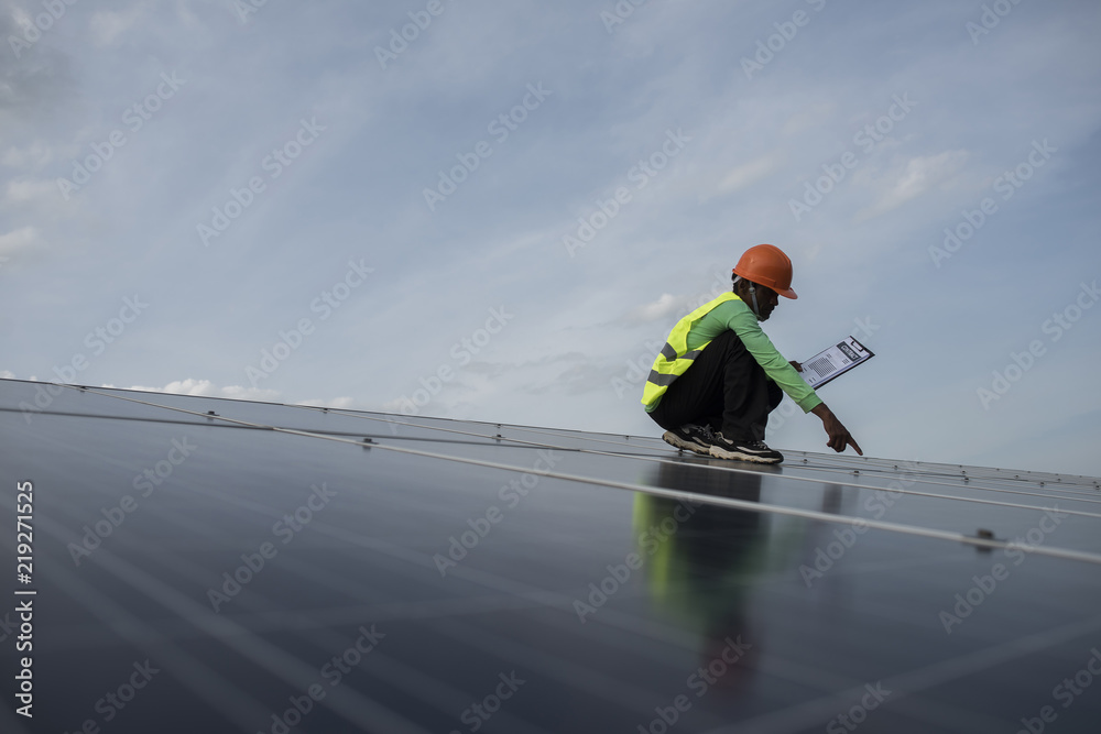 Technician engineer checks the maintenance of the solar cell panels. Technician engineer checks the maintenance of the solar cell panels.