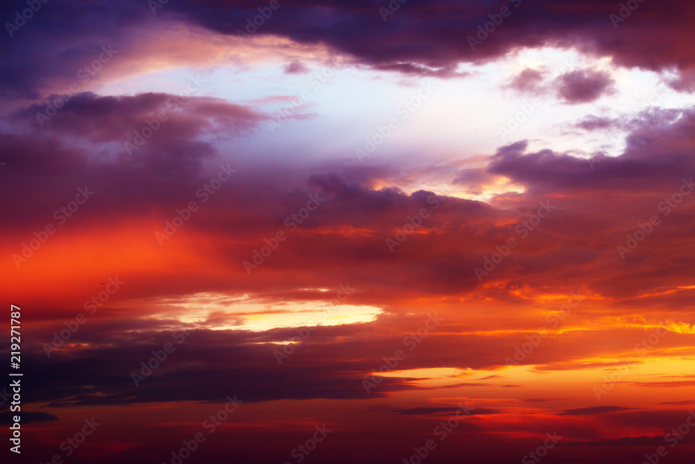 the evening sky with clouds at sunset