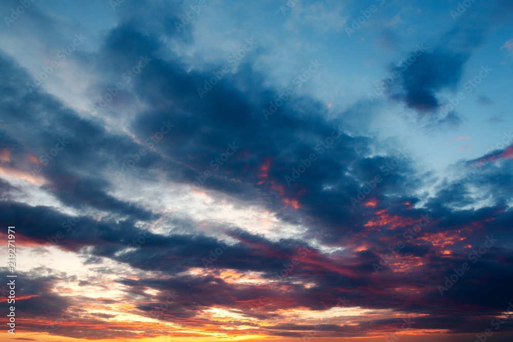 the evening sky with clouds at sunset