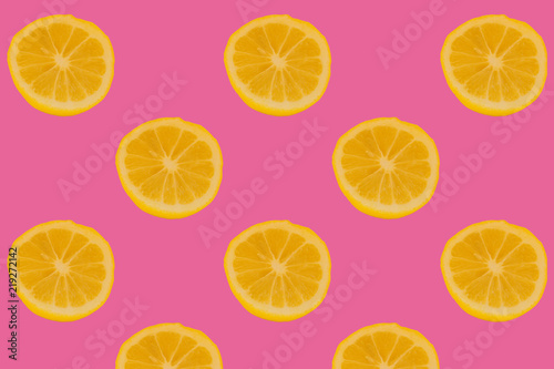 cutted fresh lemons on bright pink background