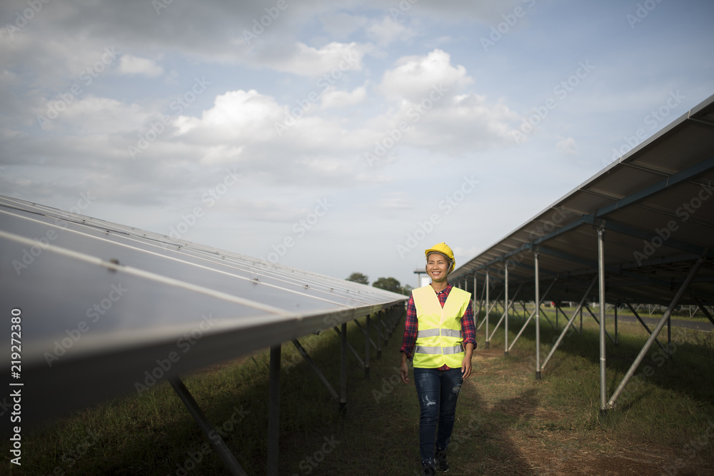 Engineer electric woman checking and maintenance of solar cells. Engineer electric woman checking and maintenance of solar cells.