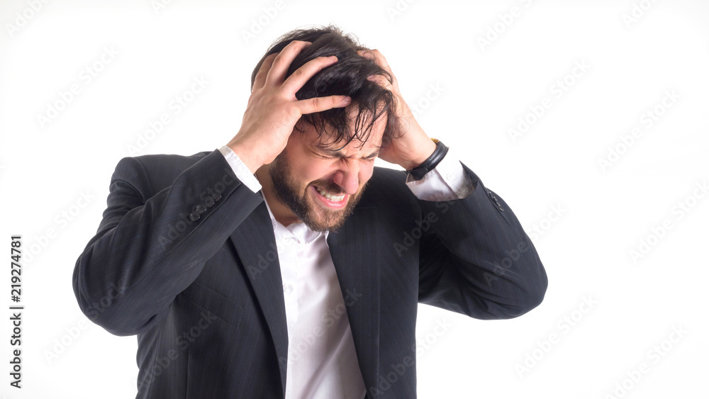 the businessman has a strong headache. He holds his hands on his head and closed his eyes in pain. Close-up portrait. Isolated on white. the businessman has a strong headache. He holds his hands on his head and closed his eyes in pain. Close-up portrait. Isolated on white.
