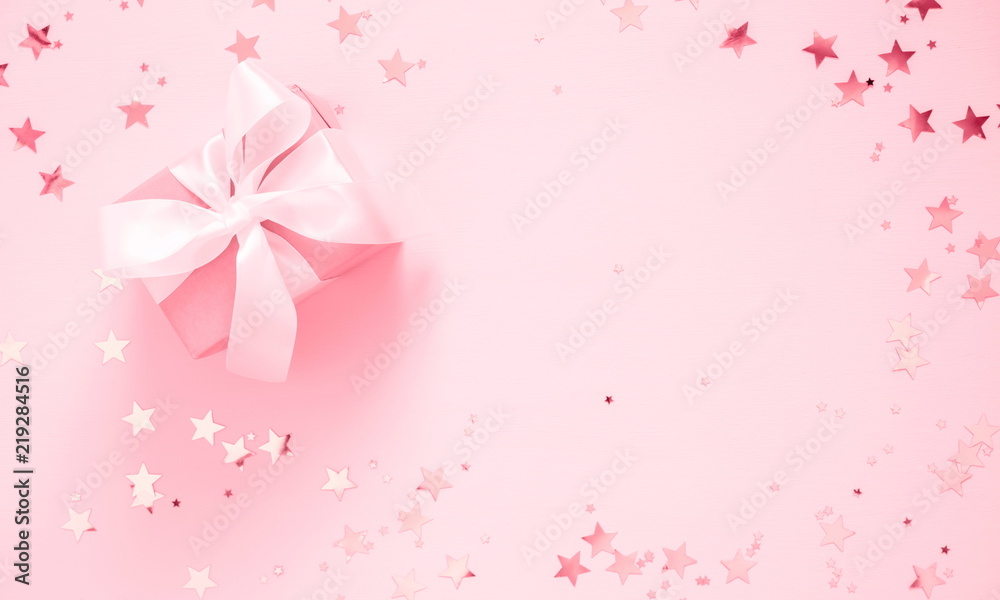 Festive pink background. Gift with satin bow and shining stars on light pink  pastel background. Christmas. Wedding. Birthday. Happy woman's day. Mothers  Day. Valentine's Day. Flat lay, top view Stock Photo |