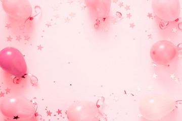 Festive pink background. Shining stars and balloons on light pink pastel background. Christmas. Wedding. Birthday. Happy woman's day. Mothers Day. Valentine's Day. Flat lay, top view, copy space. 