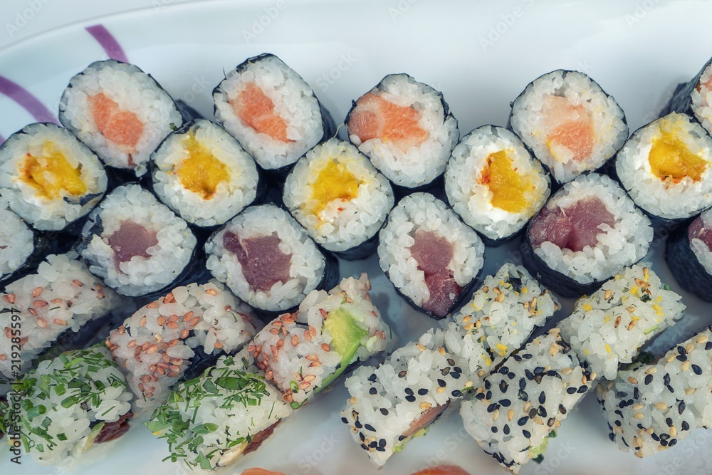 Assorted sushi set served on white plate. Assorted sushi set served on white plate.