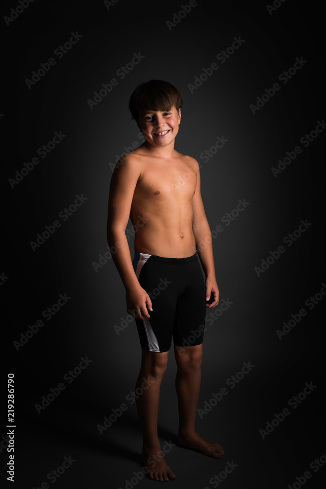 Studio portrait of boy swimmer