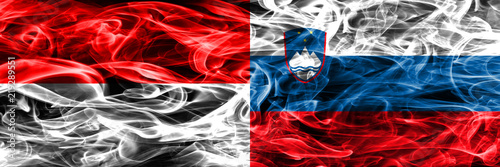 Indonesia vs Slovenia smoke flags placed side by side. Thick colored silky smoke flags of Indonesian and Slovenia