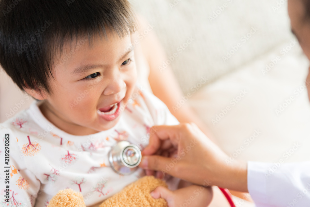 Doctor examining a little girl by using stethoscope. Medicine and health care concept. Doctor examining a little girl by using stethoscope. Medicine and health care concept.