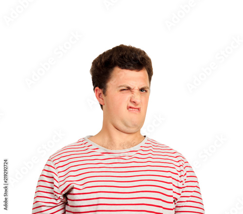 Disguting Shocked young man looking at something unpleasant and bad. emotional man isolated on white background