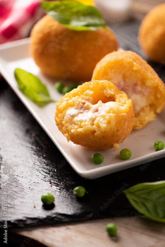 arancini di riso, fried risotto rice balls, italian sicilian food arancini di riso, fried risotto rice balls, italian sicilian food