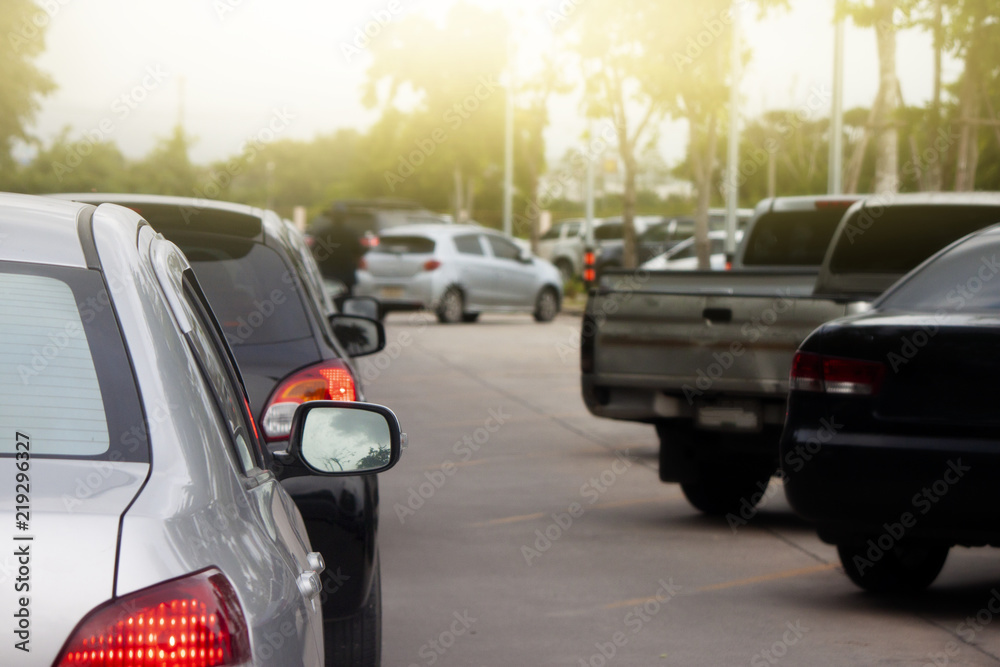 Cars with light break stop on the road inside parking area. Cars with light break stop on the road inside parking area.