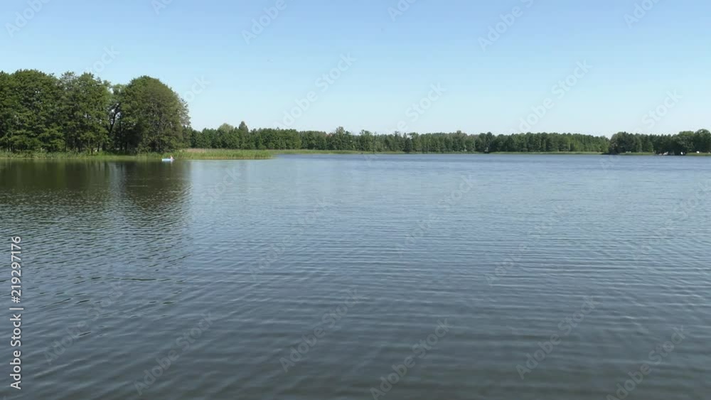 Polish lake. Beautiful lake, trees in the background. Panning,Closeup, Polish lake. Beautiful lake, trees in the background. Panning,Closeup,