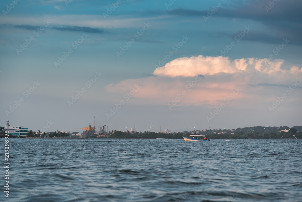 motor boat transporting passengers through the bay of Cartagena before nightfall as boats can not circulate in the area of the bay at dusk. Colombia