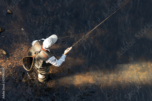 Fly fisherman using flyfishing rod