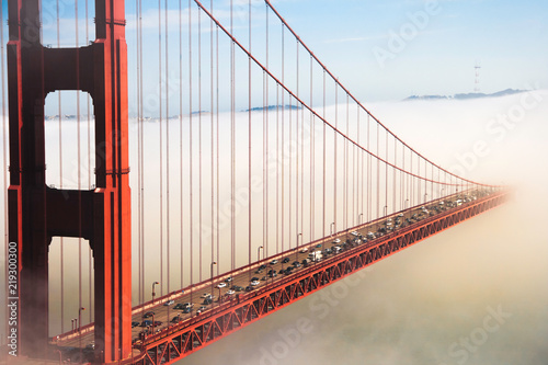 Overlook of the famous landmark the Golden Gate Bridge caught in the mist, San Francisco, California pacific coast, USA.