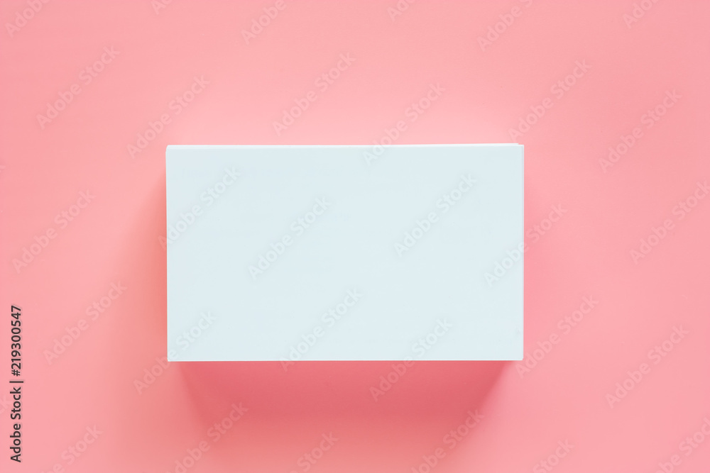 Blank business cards on pink background for contact and communication concept Blank business cards on pink background for contact and communication concept