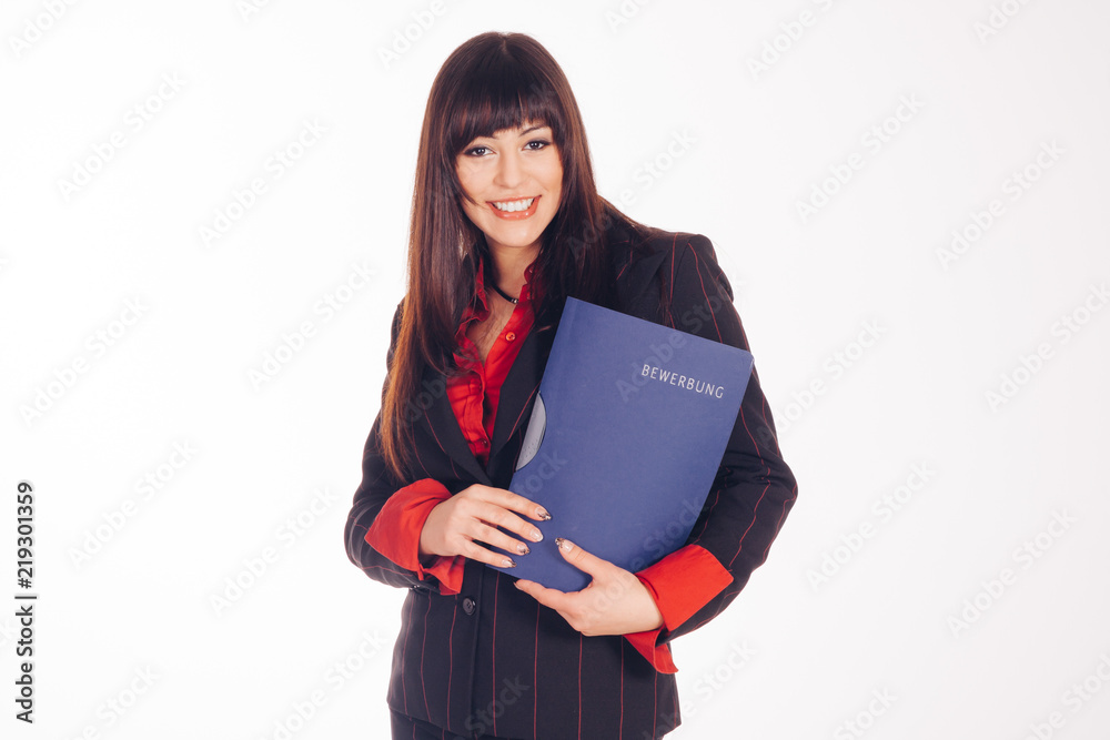 beautiful woman with dark hair and dark eyes holding folder with bewerbung signed on it isolated beautiful woman with dark hair and dark eyes holding folder with bewerbung signed on it isolated