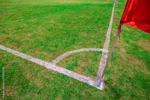 Red flag  of football stadium and soccer corner of a soccer field