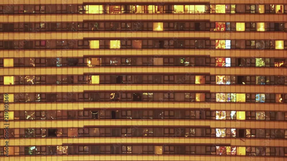 Timelapse of hotel windows at night in downtown Shanghai. Time lapse of modern building rooms at nighttime in downtown area. Modern fast paced lifestyle. Timelapse of hotel windows at night in downtown Shanghai. Time lapse of modern building rooms at nighttime in downtown area. Modern fast paced lifestyle.