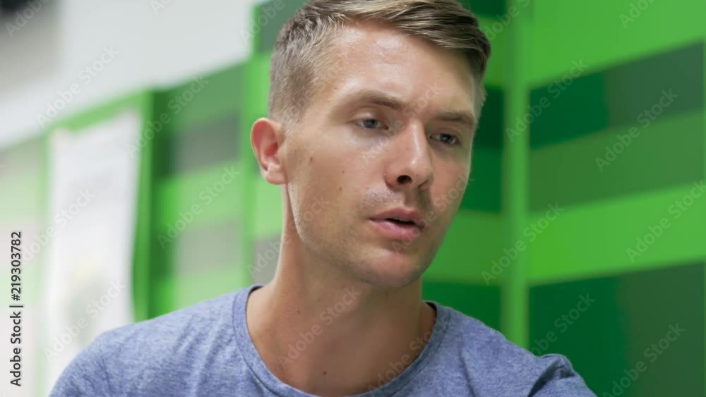 Young handsome man visits bank to solve his credit card issues Young handsome man visits bank to solve his credit card issues