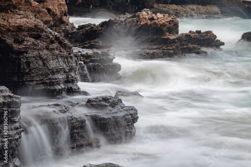 waves crashing on rocks