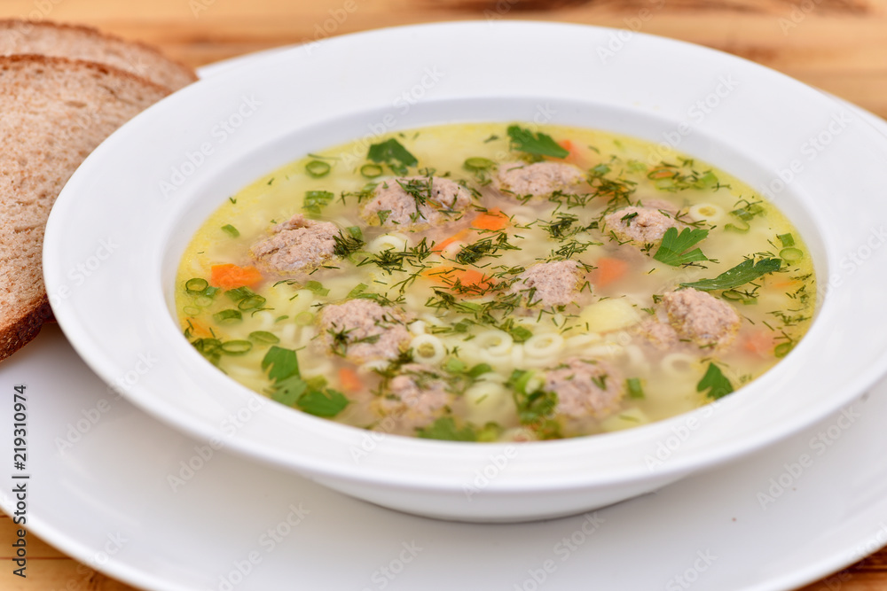 A bowl of soup on the table. Useful food.