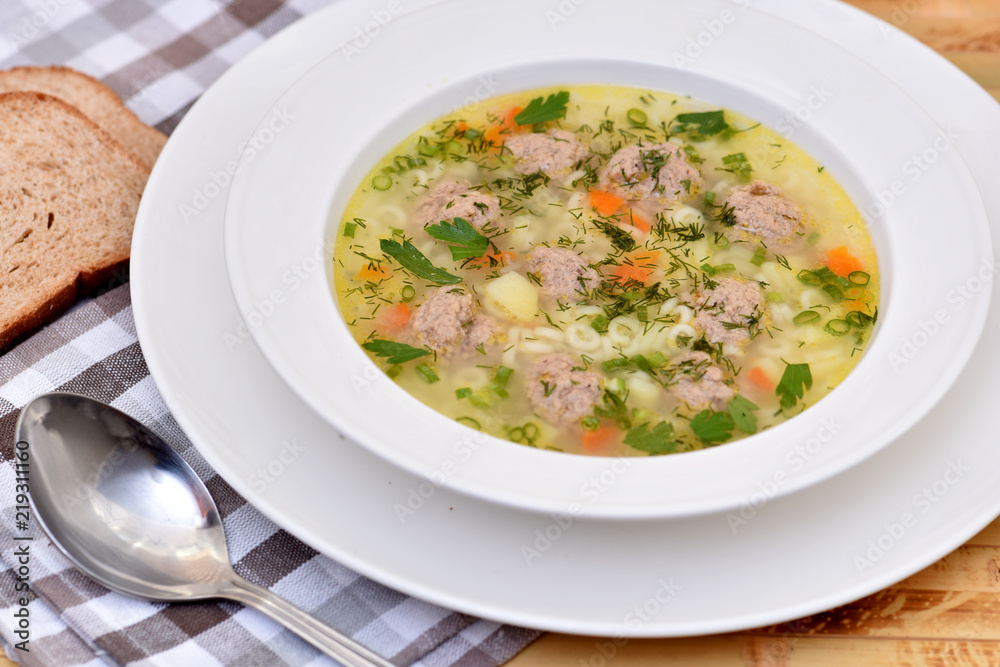 A bowl of soup on the table. Useful food.