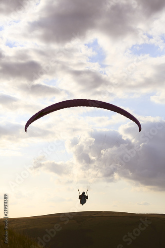 Paraglider flying in Peak District UK