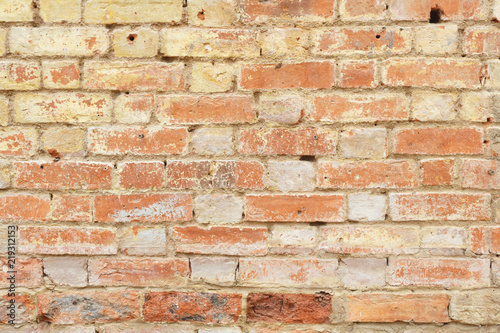 Old crumbling brick wall background