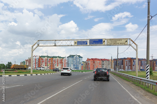 Circular traffic at the intersection with the highway near West bypass and road signs with directions Kropotkin, Yeisk, Rostov highway and others