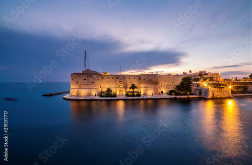Night landscape of Aragonese Castle on seafront in Taranto. Italy amazing sunset photo