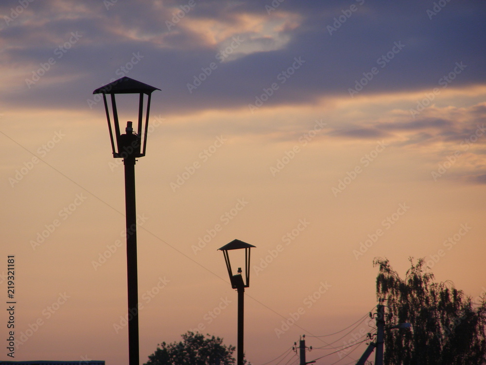 Old street lights at sunset