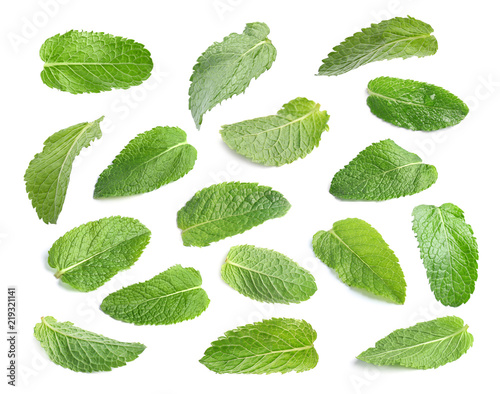 Set with fresh green mint leaves on white background