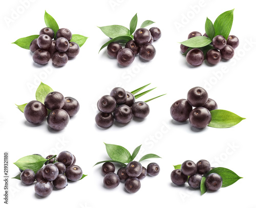 Set with acai berries and green leaves on white background. Organic superfood