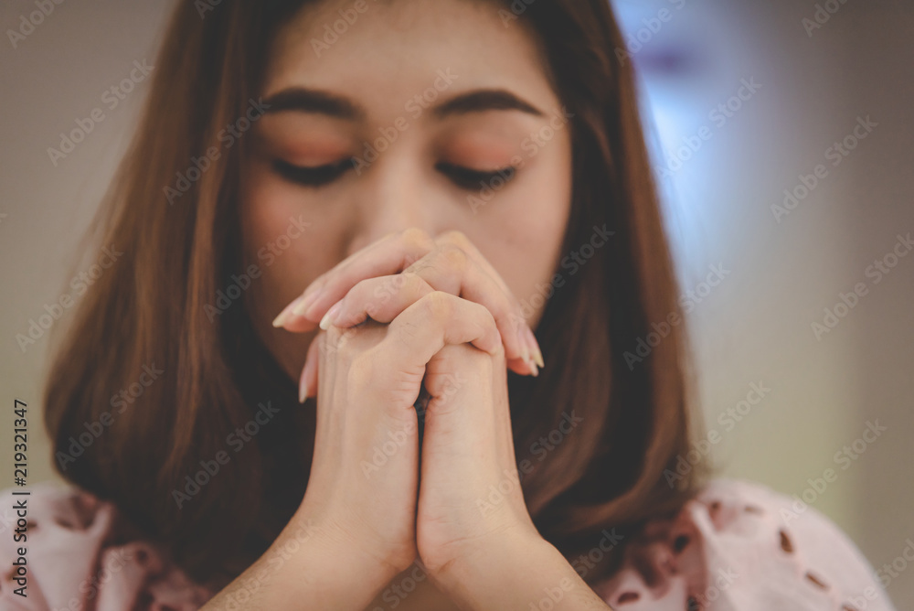 Women praying to the holy scripture. Her pray hands Bible in church for the faith and spiritual christian concept of religion. Women praying to the holy scripture. Her pray hands Bible in church for the faith and spiritual christian concept of religion.