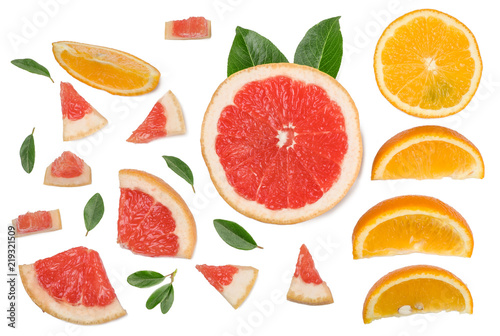 Sliced pieces of grapefruit, orange, lemon isolated on white, top view