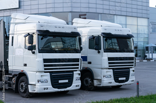Wallpaper Mural Cabs of two trucks on the background of the shopping center. Torontodigital.ca