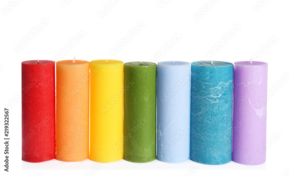 Different colorful wax candles on white background Different colorful wax candles on white background