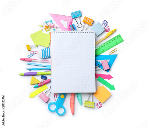 Composition with different school stationery and notebook on white background